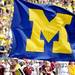 A Michigan cheerleader runs a block M flag during pre game at Michigan Stadium on Saturday, August 31, 2013. Melanie Maxwell | AnnArbor.com